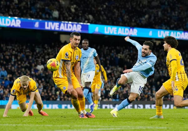 Manchester, England, 7th January 2026. Rayan Cherki of Manchester City has his shot blocked by Lewis Dunk of Brighton during the Manchester City vs Brighton and Hove Albion Premier League match at the Etihad Stadium, Manchester. Picture credit should read: Andrew Yates Sportimage EDITORIAL USE ONLY. No use with unauthorised audio, video, data, fixture lists, club league logos or live services. Online in-match use limited to 120 images, no video emulation. No use in betting, games or single club league player publications. SPI_067_AY_Man_City_Brighton SPI-4435-0067
