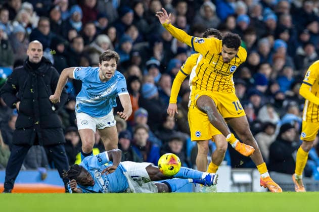 7th January 2026; Etihad Stadium, Manchester, Lancashire, England; Premier League Football, Manchester City versus Brighton and Hove Albion; Jeremy Doku of Manchester City is tackled by Georginio Rutter of Brighton  TimxWilliams