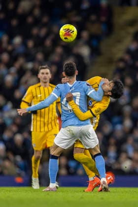 7th January 2026; Etihad Stadium, Manchester, Lancashire, England; Premier League Football, Manchester City versus Brighton and Hove Albion; Phil Foden of Manchester City under pressure from Kaoru Mitoma of Brighton  TimxWilliams