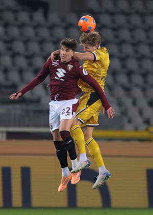 Turin, Italy, 7th January 2026. Cesare Casadei of Torino FC battles for an aerial ball with Thomas Kristensen of Udinese Calcio during the Torino vs Udinese Serie A match at Stadio Grande Torino, Turin. Picture credit should read: Jonathan Moscrop Sportimage EDITORIAL USE ONLY. No use with unauthorised audio, video, data, fixture lists, club league logos or live services. Online in-match use limited to 120 images, no video emulation. No use in betting, games or single club league player publications. SPI_064_JM_TORO_UDINESE_ SPI-4408-0064
