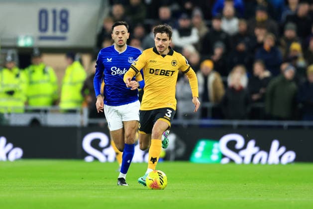 Liverpool, England, 7th January 2026. Hugo Bueno of Wolverhampton Wanderers runs with the ball whilst under pressure from Dwight McNeil of Everton during the Everton vs Wolverhampton Wanderers Premier League match at Hill Dickinson Stadium, Liverpool. Picture credit should read: Jessica Hornby Sportimage EDITORIAL USE ONLY. No use with unauthorised audio, video, data, fixture lists, club league logos or live services. Online in-match use limited to 120 images, no video emulation. No use in betting, games or single club league player publications. SPI_054_JH_EVERTON_WOLVES SPI-4436-0051