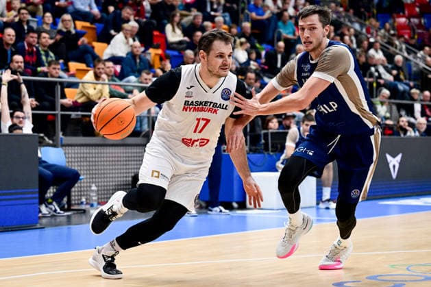 L-R Jaromir Bohacik (Nymburk) and Ryan Mikesell (Heidelberg) in action during the second game for advancement to the round of 16 of the Basketball Champions League: Nymburk - Heidelberg, Prague, Czech Republic, January 8, 2026. (CTKxPhoto OndrejxDeml) CTKPhotoP2026010808510  CTKPhotoP2026010808510