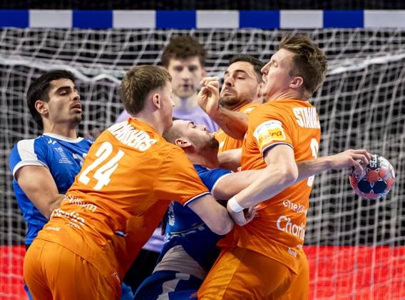 ALMERE - Greece s Theodoros Boskos is pinned down by the Netherlands Driek Manders and the Netherlands Ivar Stavast during the Dutch Golden League handball match. The handball players are preparing for the European Championship, EM, Europameisterschaft SEM VAN DER WAL ANP xVIxANPxSportx xxANPxIVx 546719057 originalFilename: 546719057.jpg