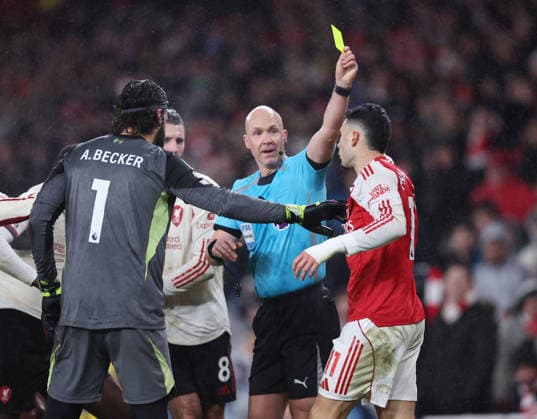 London, England, 8th January 2026. Gabriel Martinelli of Arsenal receives a yellow card from referee Anthony Taylor during the Arsenal vs Liverpool Premier League match at the Emirates Stadium, London. Picture credit should read: David Klein Sportimage EDITORIAL USE ONLY. No use with unauthorised audio, video, data, fixture lists, club league logos or live services. Online in-match use limited to 120 images, no video emulation. No use in betting, games or single club league player publications. SPI_060_DK_Arsenal_Liverpool SPI-4439-0061