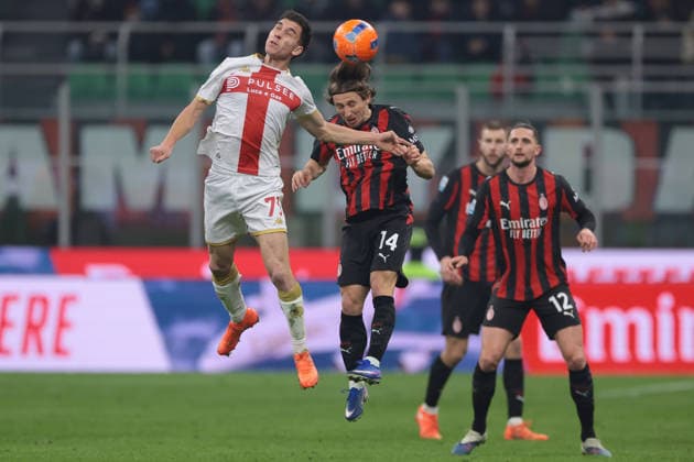 Milan, Italy, 8th January 2026. Adrien Rabiot of AC Milan and Strahinja Pavlovic of AC Milan look on as Patrizio Masini of Genoa CFC heads on from Luka Modric of AC Milan during the AC Milan vs Genoa Serie A match at Giuseppe Meazza, Milan. Picture credit should read: Jonathan Moscrop Sportimage EDITORIAL USE ONLY. No use with unauthorised audio, video, data, fixture lists, club league logos or live services. Online in-match use limited to 120 images, no video emulation. No use in betting, games or single club league player publications. SPI_090_JM_MILAN_GENOA_ SPI-4409-0090