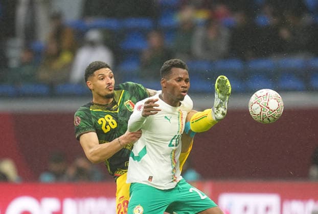 Nathan Gassma (Mali) and Mouhamadou Habibou Diallo (Senegal) battle for the ball during the Africa Cup Of Nations match between Senegal and Mali at Tangier Stadium on January 9, 2026 in Tangier, Morocco. (Photo by Thor Wegner DeFodi Images) - *** Nathan Gassma Mali and Mouhamadou Habibou Diallo Senegal battle for the ball during the Africa Cup Of Nations match between Senegal and Mali at Tangier Stadium on January 9, 2026 in Tangier, Morocco Photo by Thor Wegner DeFodi Images