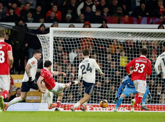 Wrexham, Wales, 9th January 2026. Ollie Rathbone of Wrexham scores their second goal (2-0) during the Wrexham vs Nottingham Forest FA Cup third round match at the SToK Cae Ras, Wrexham. Picture credit should read: Cody Froggatt Sportimage EDITORIAL USE ONLY. No use with unauthorised audio, video, data, fixture lists, club league logos or live services. Online in-match use limited to 120 images, no video emulation. No use in betting, games or single club league player publications. SPI_044_CF_Wrexham_Forest SPI-4440-0046