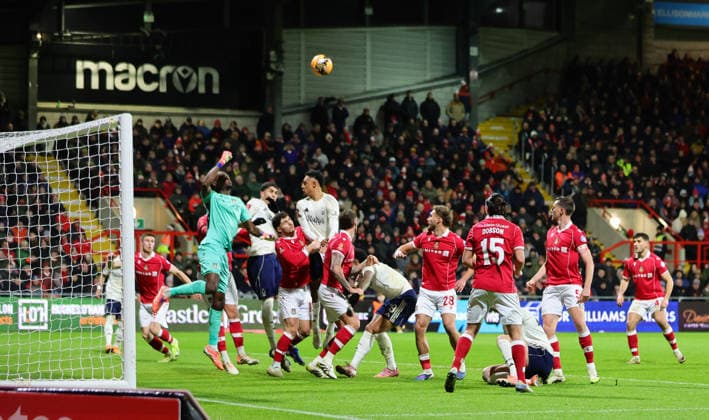 9th January 2026; Racecourse Ground, Wrexham, Wales; FA Cup Football, Wrexham versus Nottingham Forest; Arthur Okonkwo of Wrexham AFC punches clear  RogerxEvans