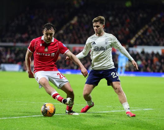 9th January 2026; Racecourse Ground, Wrexham, Wales; FA Cup Football, Wrexham versus Nottingham Forest; Ollie Rathbone of Wrexham AFC tracked by James McAtee of Nottingham Forest  RogerxEvans