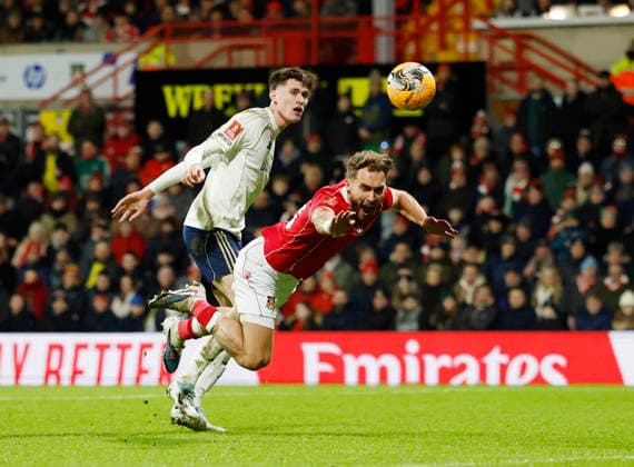 Wrexham, Wales, 9th January 2026. NicolÃ² Savona of Nottingham Forest challenges Sam Smith of Wrexham during the Wrexham vs Nottingham Forest FA Cup third round match at the SToK Cae Ras, Wrexham. Picture credit should read: Cody Froggatt Sportimage EDITORIAL USE ONLY. No use with unauthorised audio, video, data, fixture lists, club league logos or live services. Online in-match use limited to 120 images, no video emulation. No use in betting, games or single club league player publications. SPI_061_CF_Wrexham_Forest SPI-4440-0064