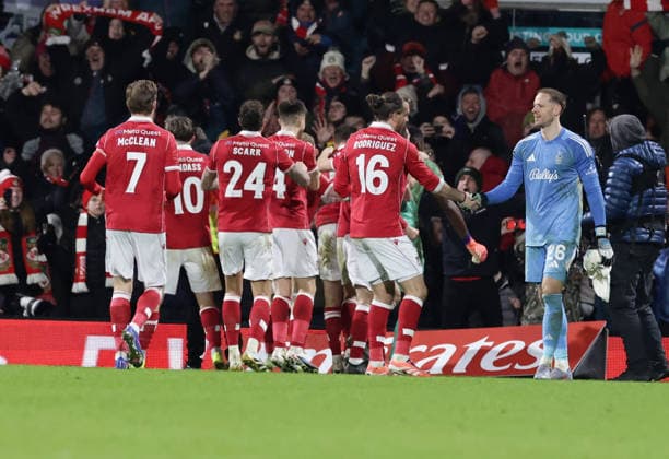 9th January 2026; Racecourse Ground, Wrexham, Wales; FA Cup Football, Wrexham versus Nottingham Forest; Matz Sels of Nottingham Forest congratulates Wrexham AFC players after saving to send Wrexham through 7-6 after penalties is congratulated by team mates  RogerxEvans Content restricted for UK based newspaper