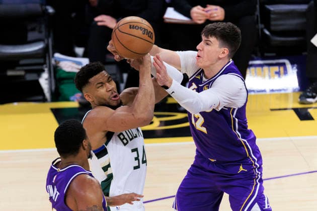 January 9, 2026, Los Angeles, California, USA: Jake LaRavia 12 of the Los Angeles Lakers attempts to steal the ball from Giannis Antetokounmpo 34 of the Milwaukee Bucks during their regular season NBA, Basketball Herren, USA game on Friday January 9, 2026 at Crypto.com Arena in Los Angeles, California. ARIANA RUIZ PI Los Angeles USA - ZUMAp124 20260109_zaa_p124_053 Copyright: xArianaxRuizx