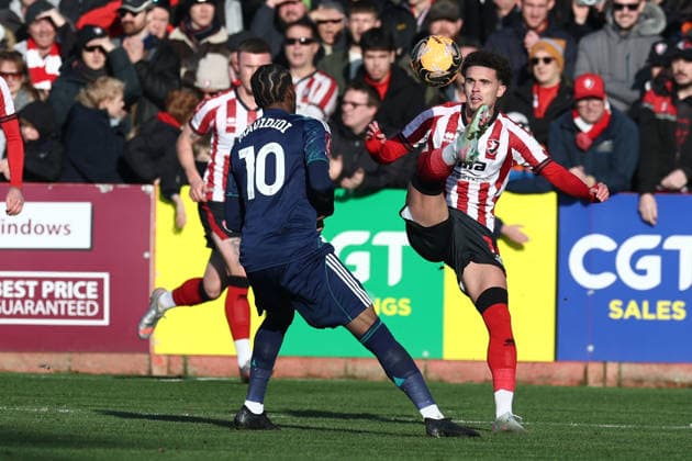 Cheltenham Town v Leicester City, FA Cup, 3rd Round Cheltenham Town midfielder Jordan Thomas (11) wins the ball ahead of Leicester City forward Stephy Mavididi (10) during the FA Cup match between Cheltenham Town and Leicester City at EV Charger Points Stadium, Cheltenham, UK on 10 January 2026. Cheltenham Jonny Rocks Stadium Gloucestershire UK Editorial use only DataCo restrictions apply See www.football-dataco.com , Copyright: xJohnxMallettx PSI-23561-0055