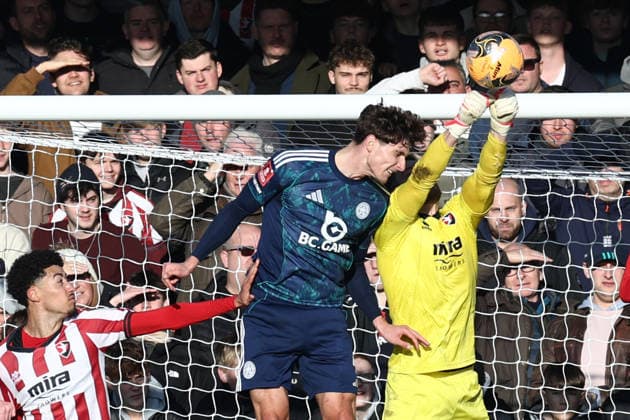 Cheltenham Town v Leicester City, FA Cup, 3rd Round Cheltenham Town goalkeeper Joe Day (1) punches off the head of Leicester City defender Ben Nelson(4) during the FA Cup match between Cheltenham Town and Leicester City at EV Charger Points Stadium, Cheltenham, UK on 10 January 2026. Cheltenham Jonny Rocks Stadium Gloucestershire UK Editorial use only DataCo restrictions apply See www.football-dataco.com , Copyright: xJohnxMallettx PSI-23561-0067