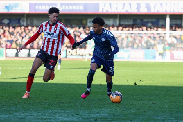 Cheltenham Town v Leicester City, FA Cup, 3rd Round Leicester City midfielder Louis Page (25) takes on Cheltenham Town defender Jonathan Tomkinson (27) during the FA Cup match between Cheltenham Town and Leicester City at EV Charger Points Stadium, Cheltenham, UK on 10 January 2026. Cheltenham Jonny Rocks Stadium Gloucestershire UK Editorial use only DataCo restrictions apply See www.football-dataco.com , Copyright: xJohnxMallettx PSI-23561-0079