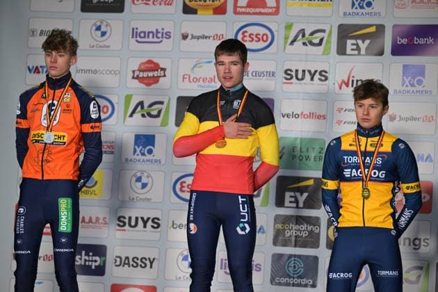 L-R, second Giel Lejeune, winner Belgian champion Belgian Jari Van Lee and third Bas Vanden Eynde celebrate on the podium of the Junior men race at the Belgian Cyclocross Championships in Beringen on Saturday 10 January 2026. DAVIDxPINTENS  x154960065x