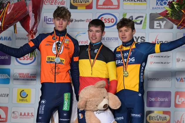 L-R, second Giel Lejeune, winner Belgian champion Belgian Jari Van Lee and third Bas Vanden Eynde celebrate on the podium of the Junior men race at the Belgian Cyclocross Championships in Beringen on Saturday 10 January 2026. DAVIDxPINTENS  x154960257x
