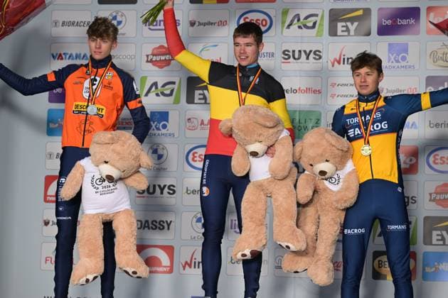 L-R, second Giel Lejeune, winner Belgian champion Belgian Jari Van Lee and third Bas Vanden Eynde celebrate on the podium of the Junior men race at the Belgian Cyclocross Championships in Beringen on Saturday 10 January 2026. DAVIDxPINTENS  x154960420x