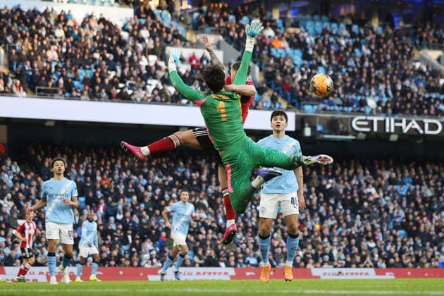 Jayden Wareham of Exeter City challenges James Trafford of Manchester City for the ball Manchester City v Exeter City, Emirates FA Cup, Third Round, Football, Etihad Stadium, Manchester, UK - 10 Jan 2026Manchester Etihad Stadium United Kingdom EDITORIAL USE ONLY No use with unauthorised audio, video, data, fixture lists, club league logos or live services. Online in-match use limited to 120 images, no video emulation. No use in betting, games or single club league player publications. Copyright: xWillxCooper Shutterstockx 16246255m