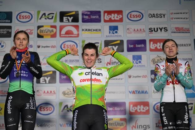 L-R, second Belgian Fleur Moors, winner Belgian Marion Norbert Riberolle and third Belgian Kiona Crabbe celebrate on the podium of the Women elite race at the Belgian Cyclocross Championships in Beringen on Saturday 10 January 2026. DAVIDxPINTENS  x154974910x