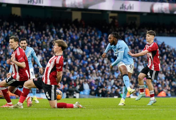 Manchester, England, 10th January 2026. Antoine Semenyo of Manchester City sees his hot blocked by Ed Turns of Exeter City during the Manchester City vs Exeter City FA Cup match at the Etihad Stadium, Manchester. Picture credit should read: Andrew Yates Sportimage EDITORIAL USE ONLY. No use with unauthorised audio, video, data, fixture lists, club league logos or live services. Online in-match use limited to 120 images, no video emulation. No use in betting, games or single club league player publications. SPI_040_AY_Man_City_Exeter SPI-4442-0039