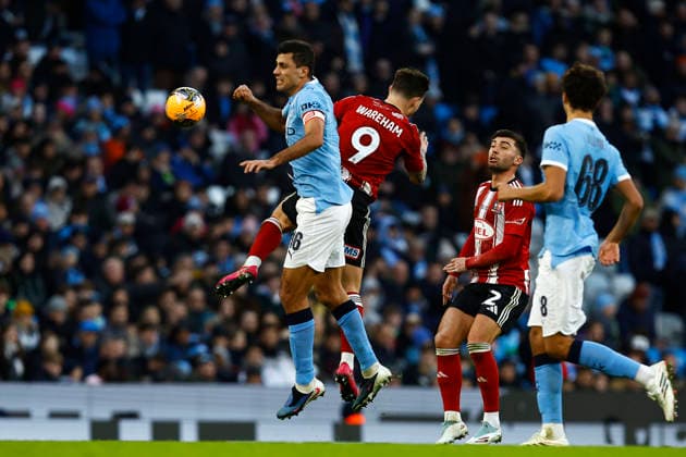 Manchester City v Exeter City, Manchester, UK - 10 January 2026 Rodri of Manchester City battles for the ball with Jayden Wareham of Exeter City during the Emirates FA Cup Round 3 match between Manchester City and Exeter City at The Etihad Stadium on 10 January 2026 in Manchester, England (Photo by Steve Taylor PPAUK) Manchester The Etihad Stadium Greater Manchester England Copyright: xStevexTaylor PPAUKx PPA-239597