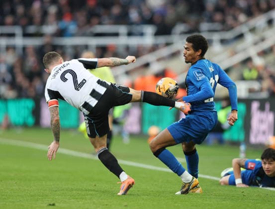 Newcastle Upon Tyne, England, 10th January 2026. Kieran Trippier of Newcastle United goes in high on Djordje Petrovic of Bournemouth during the Newcastle United vs AFC Bournemouth FA Cup match at St. James Park, Newcastle Upon Tyne. Picture credit should read: Nigel Roddis Sportimage EDITORIAL USE ONLY. No use with unauthorised audio, video, data, fixture lists, club league logos or live services. Online in-match use limited to 120 images, no video emulation. No use in betting, games or single club league player publications. SPI_026_NR_NEWC_BOUR SPI-4441-0026