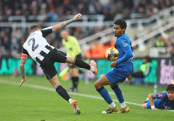 Newcastle Upon Tyne, England, 10th January 2026. Kieran Trippier of Newcastle United goes in high on Djordje Petrovic of Bournemouth during the Newcastle United vs AFC Bournemouth FA Cup match at St. James Park, Newcastle Upon Tyne. Picture credit should read: Nigel Roddis Sportimage EDITORIAL USE ONLY. No use with unauthorised audio, video, data, fixture lists, club league logos or live services. Online in-match use limited to 120 images, no video emulation. No use in betting, games or single club league player publications. SPI_027_NR_NEWC_BOUR SPI-4441-0027