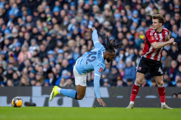 10th January 2026; Etihad Stadium, Manchester, Lancashire, England; FA Cup Football, Manchester City versus Exeter City; Antoine Semenyo of Manchester City is tackled by Ed Turns of Exeter City  TimxWilliams