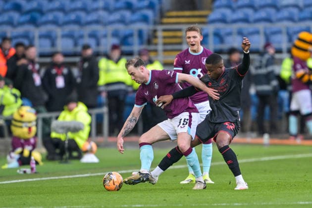 10th January 2026; Turf Moor, Burnley, Lancashire, England; FA Cup Football, Burnley versus Millwall; Aidomo Emakhu of Millwall pressures Ashley Barnes of Burnley  LeexDurkin