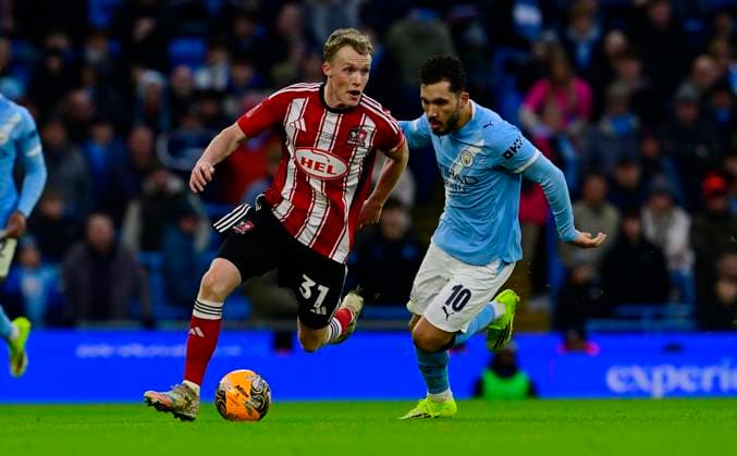 Manchester City v Exeter City, Manchester, UK - 10 Jan 2026 Jake Doyle-Hayes of Exeter City battles for the ball with Rayan Cherki of Manchester City during the Emirates FA Cup Third Round match between Manchester City and Exeter City on 10 January 2026 in Etihad Stadium, Manchester, England. Photo by Tom Sandberg PPAUK Manchester The Etihad Stadium Greater Manchester England Copyright: xTomxSandberg PPAUKx PPA-239623