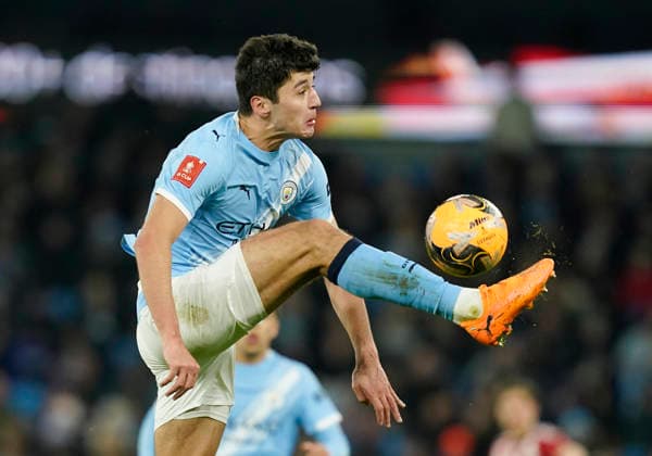 Manchester, England, 10th January 2026. Abdukodir Khusanov of Manchester City jumps to collect the ball during the Manchester City vs Exeter City FA Cup match at the Etihad Stadium, Manchester. Picture credit should read: Andrew Yates Sportimage EDITORIAL USE ONLY. No use with unauthorised audio, video, data, fixture lists, club league logos or live services. Online in-match use limited to 120 images, no video emulation. No use in betting, games or single club league player publications. SPI_053_AY_Man_City_Exeter SPI-4442-0051