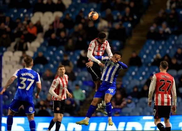 Ethan Pinnock of Brentford in action against Devlan Moses of Sheffield Wednesday Sheffield Wednesday v Brentford, Emirates FA Cup, Third Round, Football, Hillsborough, Sheffield, UK - 10 Jan 2026Sheffield Hillsborough United Kingdom EDITORIAL USE ONLY No use with unauthorised audio, video, data, fixture lists, club league logos or live services. Online in-match use limited to 120 images, no video emulation. No use in betting, games or single club league player publications. Copyright: xGeorgexTewkesbury Shutterstockx 16246263cf