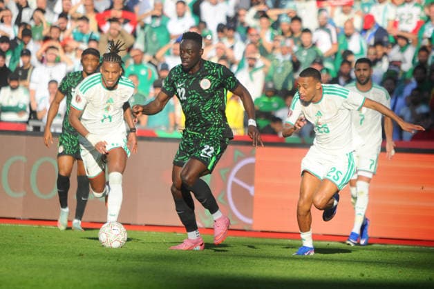 MARRAKECH, MOROCCO - JANUARY 10: Akor Adams of Nigeria and Hicham Boudaoui and Rafik Belghali of Algeria during the Africa Cup of Nations (AFCON) match between Algeria and Nigeria at the Grand Stade on January 10th, 2026 in Marrakech, Morocco. Photo by Segun Ogunfeyitimi Copyright: xshengolpixsx