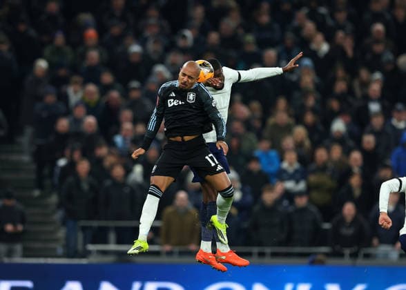 10th January 2026; Tottenham Hotspur Stadium, London, England; FA Cup Football, Tottenham Hotspur versus Aston Villa; Kevin Danso of Tottenham Hotspur heads the ball over Donyell Malen of Aston Villa  JohnxPatrickxFletcher