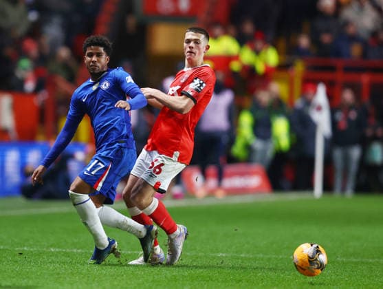 London, England, 10th January 2026. Andrey Santos of Chelsea (l) tackles Keenan Gough of Charlton Athletic (r) during the Charlton Athletic vs Chelsea FA Cup match at The Valley, London. Picture credit should read: Paul Terry Sportimage EDITORIAL USE ONLY. No use with unauthorised audio, video, data, fixture lists, club league logos or live services. Online in-match use limited to 120 images, no video emulation. No use in betting, games or single club league player publications. SPI_028_PT_Charlton_Chelsea SPI-4443-0028