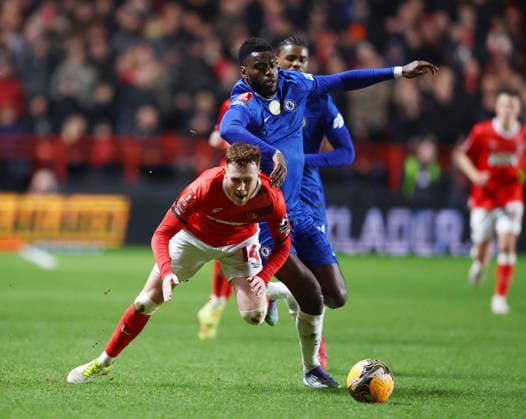 London, England, 10th January 2026. Sonny Carey of Charlton Athletic tussles with Benoit Badiashile of Chelsea during the Charlton Athletic vs Chelsea FA Cup match at The Valley, London. Picture credit should read: Paul Terry Sportimage EDITORIAL USE ONLY. No use with unauthorised audio, video, data, fixture lists, club league logos or live services. Online in-match use limited to 120 images, no video emulation. No use in betting, games or single club league player publications. SPI_030_PT_Charlton_Chelsea SPI-4443-0030