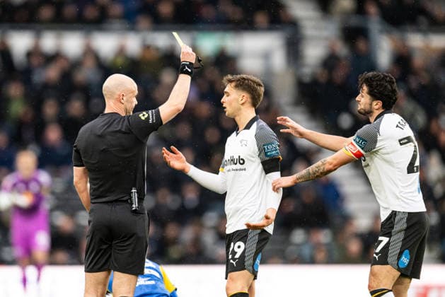 11th January 2026; Pride Park, Derby, Derbyshire, England; FA Cup Football, Derby County versus Leeds United; Referee Anthony Taylor issues a yellow card to Jake Rooney of Derby County  GodfreyxPitt Content restricted for UK based newspaper