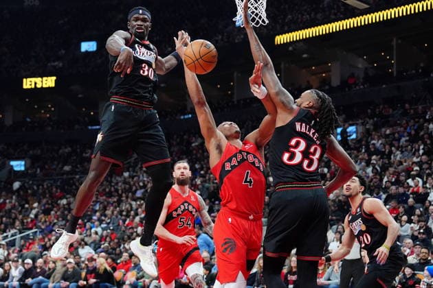 January 11, 2026, Toronto, On, CANADA: Toronto Raptors forward guard Scottie Barnes (4) gets fouled on his way to the hoop by Philadelphia 76ers forward Jabari Walker (33) as teammate Adem Bona (30) looks on during first half NBA, Basketball Herren, USA basketball action in Toronto, Sunday, Jan. 11, 2026. Canada News - January 11, 2026 - ZUMAc35_ 20260111_zaf_c35_121 Copyright: xFrankxGunnx