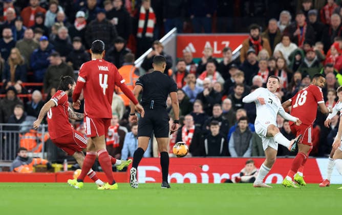 Liverpool, England, 12th January 2026. Dominik Szoboszlai of Liverpool scores to make it 1-0 during the Liverpool vs Barnsley FA Cup match at Anfield, Liverpool. Picture credit should read: Jessica Hornby Sportimage EDITORIAL USE ONLY. No use with unauthorised audio, video, data, fixture lists, club league logos or live services. Online in-match use limited to 120 images, no video emulation. No use in betting, games or single club league player publications. SPI_049_JH_Liverpool_Barnsley SPI-4444-0049