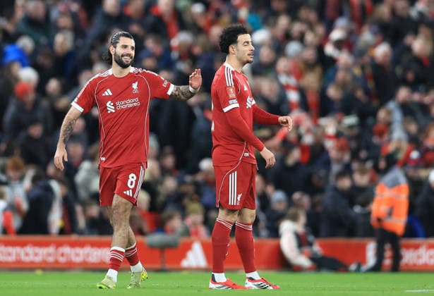 Liverpool, England, 12th January 2026. Dominik Szoboszlai (L) of Liverpool celebrates with Curtis Jones after scoring to make it 1-0 during the Liverpool vs Barnsley FA Cup match at Anfield, Liverpool. Picture credit should read: Jessica Hornby Sportimage EDITORIAL USE ONLY. No use with unauthorised audio, video, data, fixture lists, club league logos or live services. Online in-match use limited to 120 images, no video emulation. No use in betting, games or single club league player publications. SPI_051_JH_Liverpool_Barnsley SPI-4444-0051