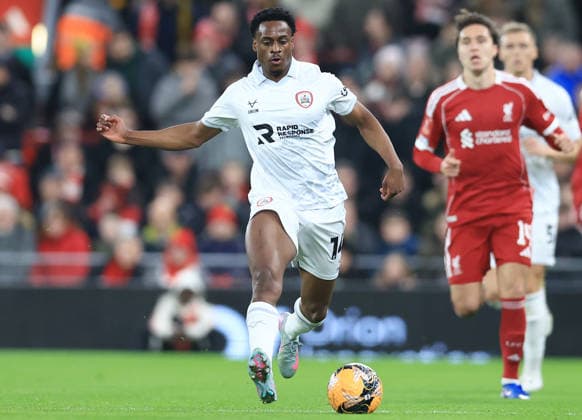 Liverpool, England, 12th January 2026. Nathanael Ogbeta of Barnsley with the ball during the Liverpool vs Barnsley FA Cup match at Anfield, Liverpool. Picture credit should read: Jessica Hornby Sportimage EDITORIAL USE ONLY. No use with unauthorised audio, video, data, fixture lists, club league logos or live services. Online in-match use limited to 120 images, no video emulation. No use in betting, games or single club league player publications. SPI_055_JH_Liverpool_Barnsley SPI-4444-0055