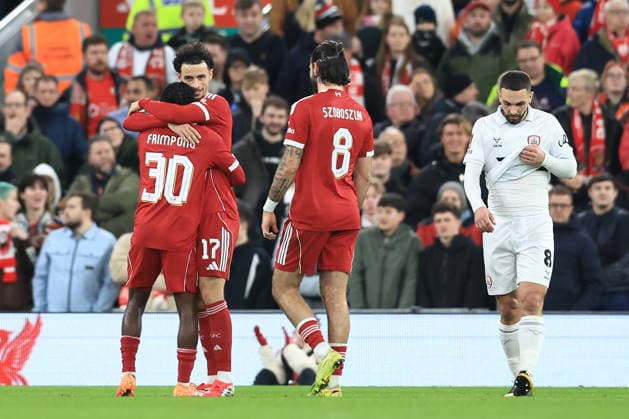 Liverpool, England, 12th January 2026. Jeremie Frimpong (L) of Liverpool celebrates after scoring to make it 2-0 during the Liverpool vs Barnsley FA Cup match at Anfield, Liverpool. Picture credit should read: Jessica Hornby Sportimage EDITORIAL USE ONLY. No use with unauthorised audio, video, data, fixture lists, club league logos or live services. Online in-match use limited to 120 images, no video emulation. No use in betting, games or single club league player publications. SPI_068_JH_Liverpool_Barnsley SPI-4444-0068