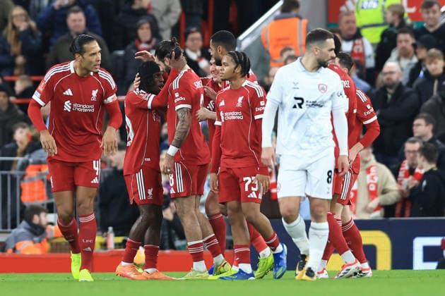 Liverpool, England, 12th January 2026. Jeremie Frimpong ( 2nd L) of Liverpool celebrates after scoring to make it 2-0 during the Liverpool vs Barnsley FA Cup match at Anfield, Liverpool. Picture credit should read: Jessica Hornby Sportimage EDITORIAL USE ONLY. No use with unauthorised audio, video, data, fixture lists, club league logos or live services. Online in-match use limited to 120 images, no video emulation. No use in betting, games or single club league player publications. SPI_069_JH_Liverpool_Barnsley SPI-4444-0069