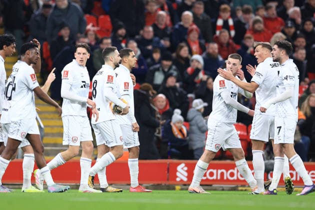 Liverpool, England, 12th January 2026. Adam Phillips (C) of Barnsley celebrates with team mates after scoring to make it 2-1 during the Liverpool vs Barnsley FA Cup match at Anfield, Liverpool. Picture credit should read: Jessica Hornby Sportimage EDITORIAL USE ONLY. No use with unauthorised audio, video, data, fixture lists, club league logos or live services. Online in-match use limited to 120 images, no video emulation. No use in betting, games or single club league player publications. SPI_077_JH_Liverpool_Barnsley SPI-4444-0077