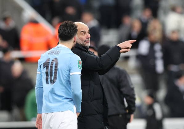 Newcastle Upon Tyne, England, 13th January 2026. Pep Guardiola manager of Manchester City reacts with Rayan Cherki after the Newcastle United vs Manchester City Carabao Cup match at St. James Park, Newcastle Upon Tyne. Picture credit should read: Nigel Roddis Sportimage EDITORIAL USE ONLY. No use with unauthorised audio, video, data, fixture lists, club league logos or live services. Online in-match use limited to 120 images, no video emulation. No use in betting, games or single club league player publications. SPI_039_NR_NEWC_MANC SPI-4449-0041
