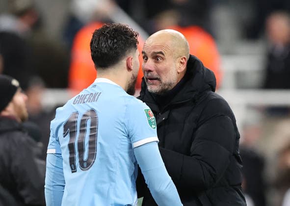 Newcastle Upon Tyne, England, 13th January 2026. Pep Guardiola manager of Manchester City reacts with Rayan Cherki after the Newcastle United vs Manchester City Carabao Cup match at St. James Park, Newcastle Upon Tyne. Picture credit should read: Nigel Roddis Sportimage EDITORIAL USE ONLY. No use with unauthorised audio, video, data, fixture lists, club league logos or live services. Online in-match use limited to 120 images, no video emulation. No use in betting, games or single club league player publications. SPI_040_NR_NEWC_MANC SPI-4449-0042
