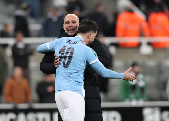 Newcastle Upon Tyne, England, 13th January 2026. Pep Guardiola manager of Manchester City reacts with Rayan Cherki after the Newcastle United vs Manchester City Carabao Cup match at St. James Park, Newcastle Upon Tyne. Picture credit should read: Nigel Roddis Sportimage EDITORIAL USE ONLY. No use with unauthorised audio, video, data, fixture lists, club league logos or live services. Online in-match use limited to 120 images, no video emulation. No use in betting, games or single club league player publications. SPI_041_NR_NEWC_MANC SPI-4449-0043