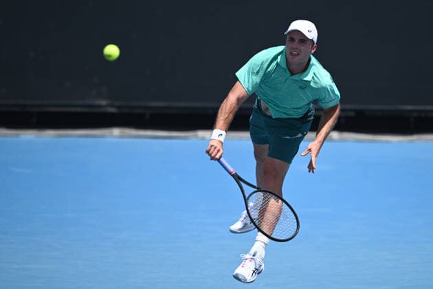 TENNIS AUSTRALIAN OPEN QUALIFYING, Arthur Fery of Great Britain in action against Bernard Tomic of Australia during a qualifying session ahead of the Australian Open tennis tournament at Melbourne Park in Melbourne, Wednesday, January 14, 2026. ( NO ARCHIVING, EDITORIAL USE ONLY MELBOURNE VICTORIA AUSTRALIA  Copyright: xJOELxCARRETTx 20260114186695931447