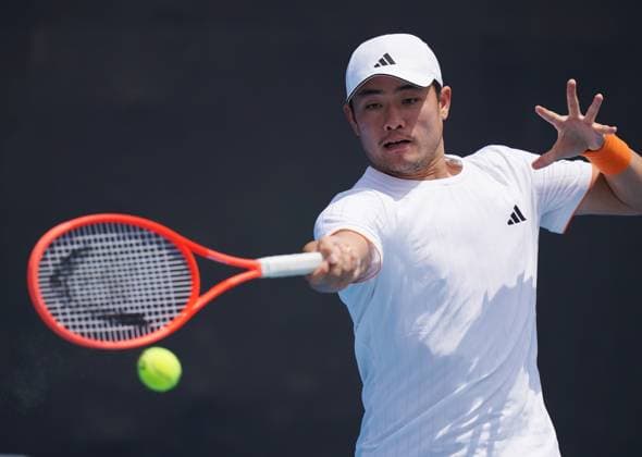 (260114) -- MELBOURNE, Jan. 14, 2026 -- Wu Yibing of China hits a return during the men s singles qualifying 2nd round match against Nicolas Mejia of Columbia at Australian Open tennis tournament in Melbourne, Australia, Jan. 14, 2026. (Photo by Xinhua) (SP)AUSTRALIA-MELBOURNE-TENNIS-AUSTRALIAN OPEN-MEN S SINGLES-QUALIFYING WangxShen 